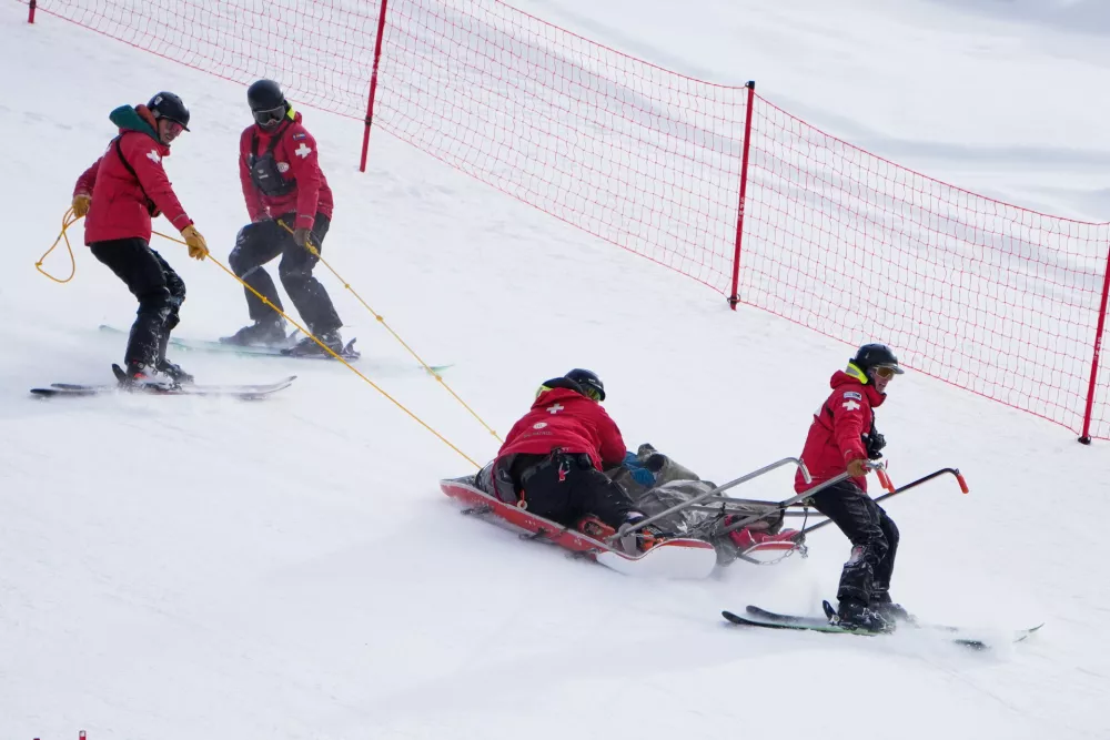 Ski patrol members bring down Slovenia's Rok Elezi Aznoh after a crash will competing during a World Cup men's downhill skiing race, Thursday, Dec. 4, 2025, in Beaver Creek, Colo. (AP Photo/John Locher)
