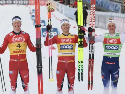 05 December 2025, Norway, Trondheim: Norway's winner Johannes Hoesflot Klaebo (C), second-placed Oskar Opstad Vike (L)&nbsp;and Sweden's third-placed Alvar Myhlback, celebrate after the Men's Sprint Final Classic competition during the FIS Cross-Country World Cup in Trondheim. Photo: Geir Olsen/NTB/dpa