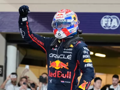 Red Bull driver Max Verstappen of the Netherlands celebrates the pole position after the qualifying for the he Abu Dhabi Formula One Grand Prix in Abu Dhabi, United Arab Emirates, Saturday, Dec. 6, 2025. (AP Photo/Darko Bandic)