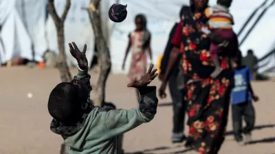 Mousa Bakr, 8, a Sudanese refugee from al-Fashir, plays with a handmade sock ball because they have no access to a real football at the Tine transit refugee camp in eastern Chad, amid the ongoing conflict between the paramilitary Rapid Support Forces (RSF) and the Sudanese army, November 23, 2025. REUTERS/Amr Abdallah Dalsh   TPX IMAGES OF THE DAY