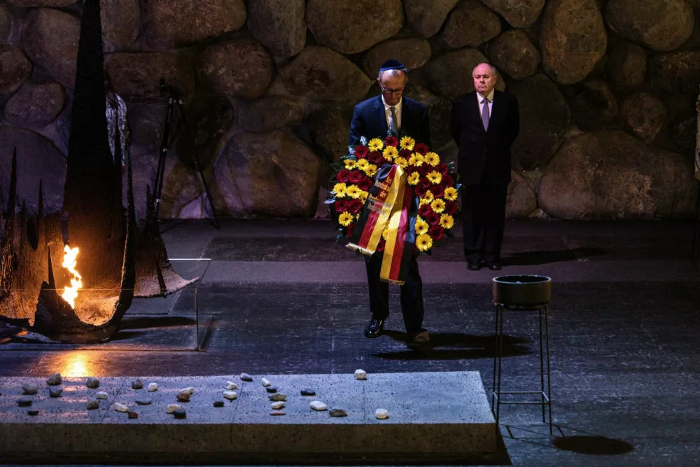 German Chancellor Friedrich Merz takes part in a wreath-laying ceremony at the Hall of Remembrance during his visit to the Yad Vashem Holocaust Memorial Museum in Jerusalem, December 7, 2025.   John Wessels/Pool via REUTERS