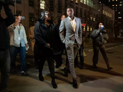 Miami Heat's Terry Rozier, center, leaves Brooklyn federal court, Monday, Dec. 8, 2025, in New York. (AP Photo/Yuki Iwamura)