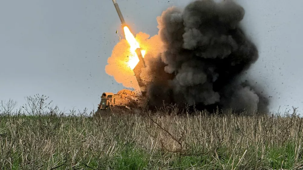 Ukrainian servicemen fire a Multiple Launch Rocket System (MLRS) towards Russian troops, amid Russia's attack on Ukraine, near the frontline town of Pokrovsk in Donetsk region, Ukraine December 9, 2025. REUTERS/Stringer