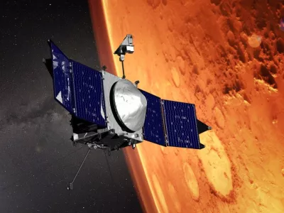 This illustration provided by NASA depicts the MAVEN (Mars Atmosphere and Volatile EvolutioN) spacecraft orbiting the planet Mars. (NASA/GSFC via AP)