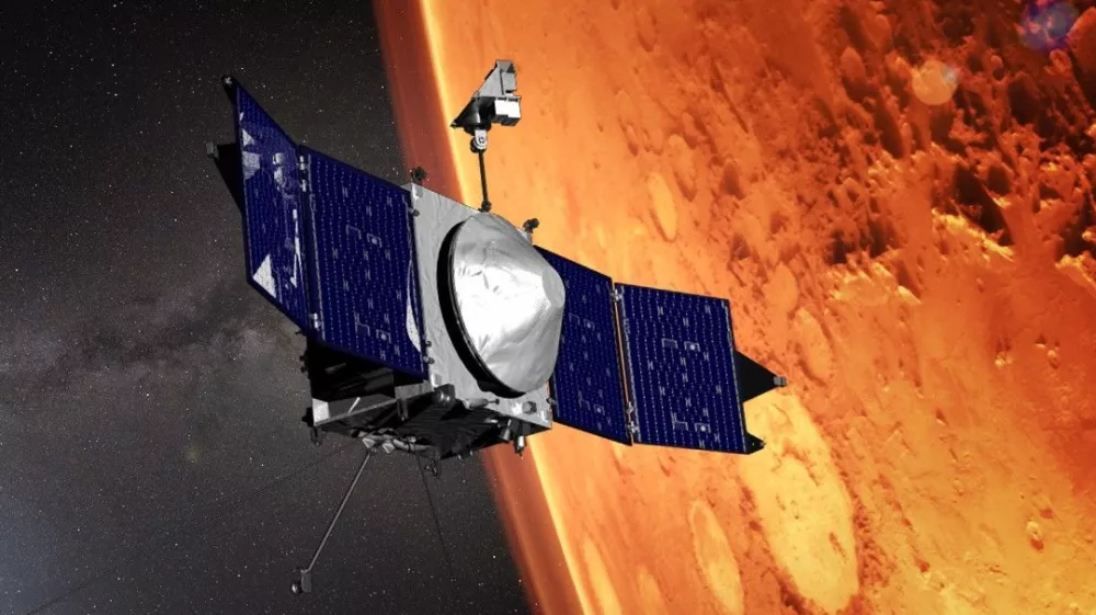This illustration provided by NASA depicts the MAVEN (Mars Atmosphere and Volatile EvolutioN) spacecraft orbiting the planet Mars. (NASA/GSFC via AP)