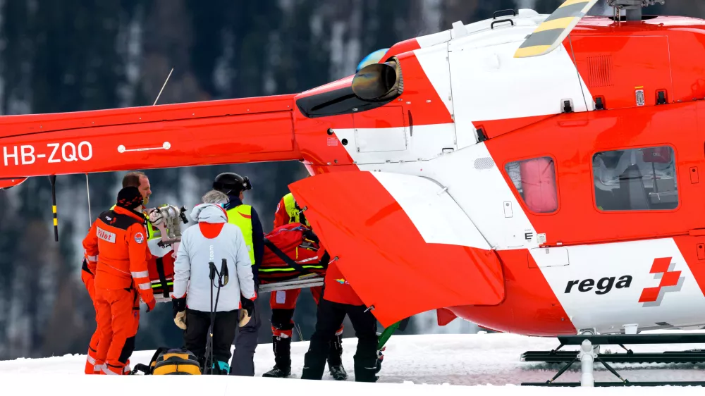 Michelle Gisin of Switzerland is being carried on a stretcher after a fall during an alpine ski, women's World Cup downhill training, in St. Moritz, Switzerland, Thursday, Dec. 11, 2025. (Keystone Via AP)