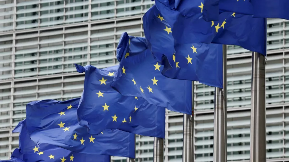 FILE PHOTO: European Union flags flutter outside the EU Commission headquarters in Brussels, Belgium July 16, 2025. REUTERS/Yves Herman/File Photo