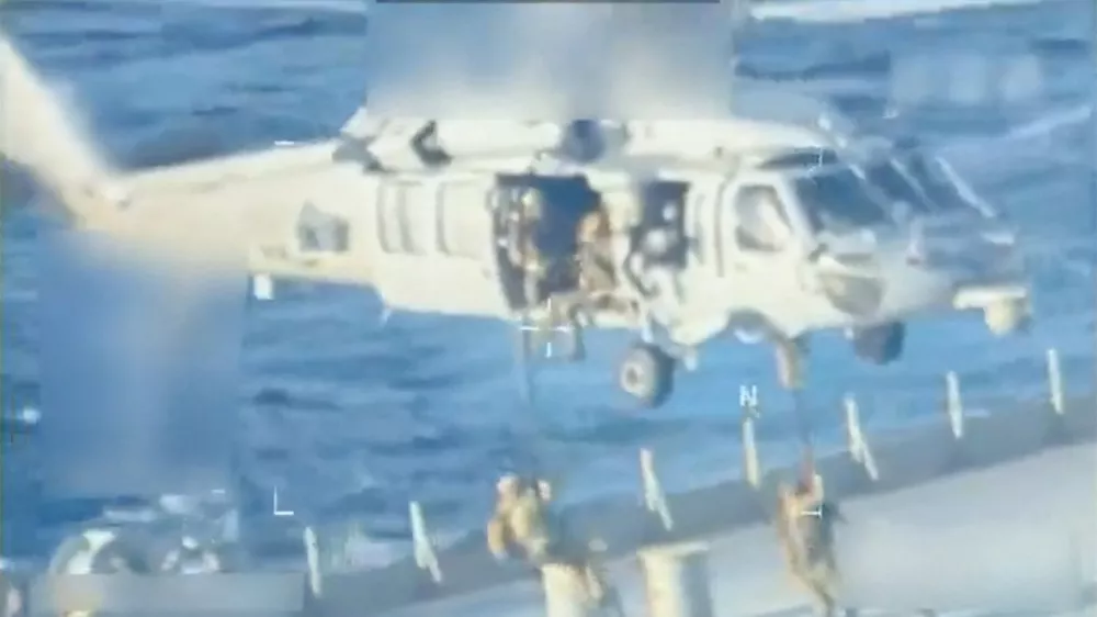 U.S. forces abseil onto an oil tanker during a raid described by U.S. Attorney General Pam Bondi as its seizure by the United States off the coast of Venezuela, December 10, 2025, in a still image from video. U.S. Attorney General/Handout via REUTERS. THIS IMAGE HAS BEEN SUPPLIED BY A THIRD PARTY. SELECTIVE BLURRING FROM SOURCE.