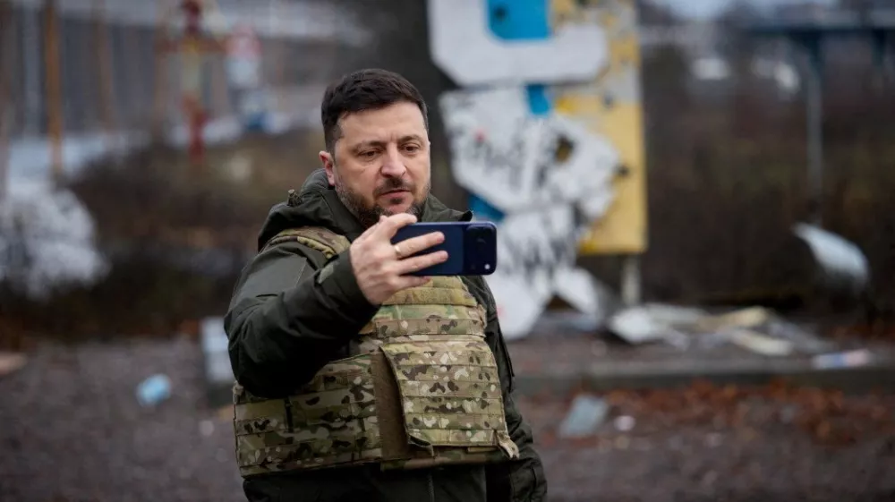 Ukraine's President Volodymyr Zelenskiy self-records a video in front of a sign that reads 'Kupiansk', amid Russia's attack on Ukraine, in the frontline town of Kupiansk, Kharkiv region, Ukraine December 12, 2025. Ukrainian Presidential Press Service/Handout via REUTERS ATTENTION EDITORS - THIS IMAGE HAS BEEN SUPPLIED BY A THIRD PARTY.