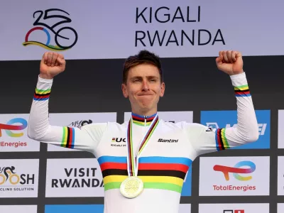 Cycling - Road World Championships 2025 - Kigali, Rwanda - September 28, 2025 Slovenia's Tadej Pogacar celebrates on the podium after winning the Men's Elite Road Race REUTERS/Jean Bizimana
