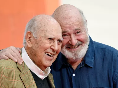 FILE - Carl Reiner, left, and his son Rob Reiner pose together following their hand and footprint ceremony at the TCL Chinese Theatre, April 7, 2017, in Los Angeles. (Photo by Chris Pizzello/Invision/AP, File)