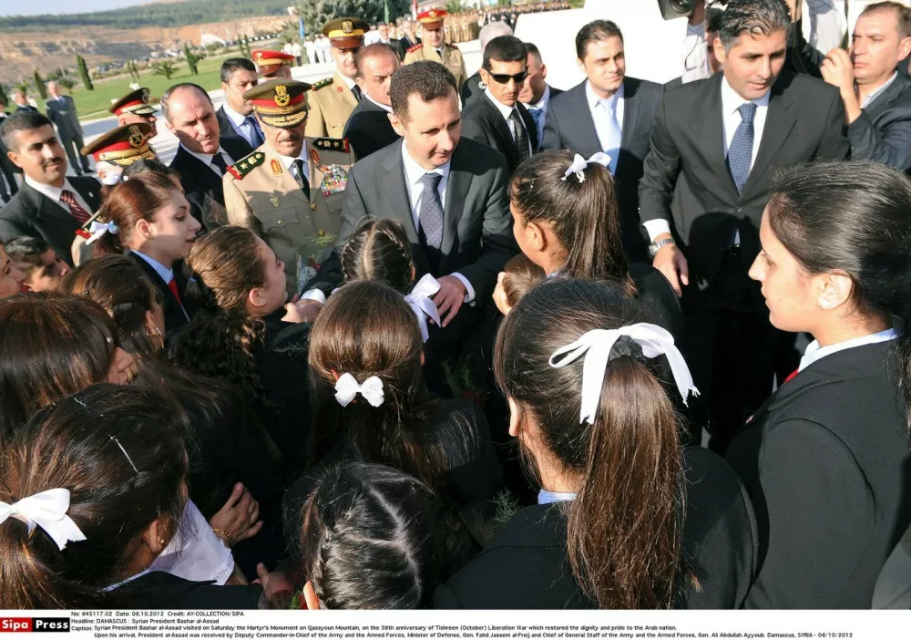 Syrian President Bashar al-Assad visited on Saturday the Martyr's Monument on Qassyoun Mountain, on the 39th anniversary of Tishreen (October) Liberation War which restored the dignity and pride to the Arab nation. Upon his arrival, President al-Assad was received by Deputy Commander-in-Chief of the Army and the Armed Forces, Minister of Defense, Gen. Fahd Jassem al-Freij and Chief of General Staff of the Army and the Armed Forces, Gen. Ali Abdullah Ayyoub. Damascus, SYRIA - 06/10/2012/Credit:AY-COLLECTION/SIPA/1210061650,Image: 227492077, License: Rights-managed, Restrictions:, Model Release: no