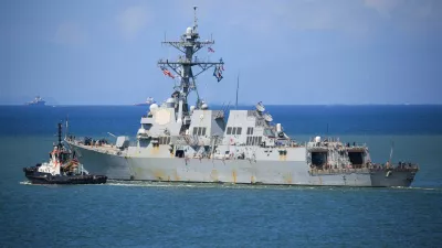 FILE PHOTO: The U.S. Navy destroyer USS Gravely (DDG-107) sails from the Port of Spain amid heightened tensions in the region between the U.S. and Venezuela, as seen from Port of Spain, Trinidad and Tobago October 30, 2025. REUTERS/Andrea de Silva/File Photo