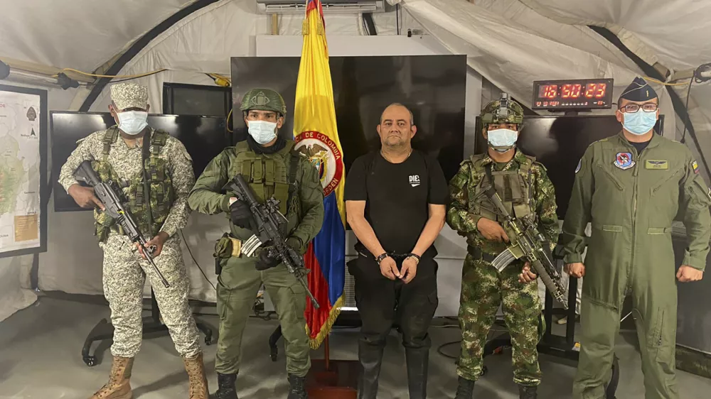 In this photo released by the Colombian presidential press office, one of the country&acirc;&euro;&trade;s most wanted drug traffickers, Dairo Antonio Usuga, alias &acirc;&euro;śOtoniel,&acirc;&euro;ť leader of the violent Clan del Golfo cartel, is presented to the media at a military base in Necocli, Colombia, Saturday, Oct. 23, 2021. (Colombian presidential press office via AP)