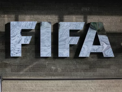 FILED - 13 December 2024, Switzerland, Zurich: The FIFA logo is seen on the facade of FIFA headquarters before the draw ceremony for the 2026 FIFA World Cup qualifiers. Photo: Christian Charisius/dpa