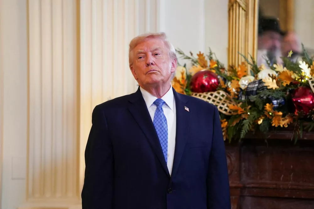 U.S. President Donald Trump looks on during a Hanukkah reception in the East Room of the White House in Washington, D.C., U.S., December 16, 2025. REUTERS/Nathan Howard