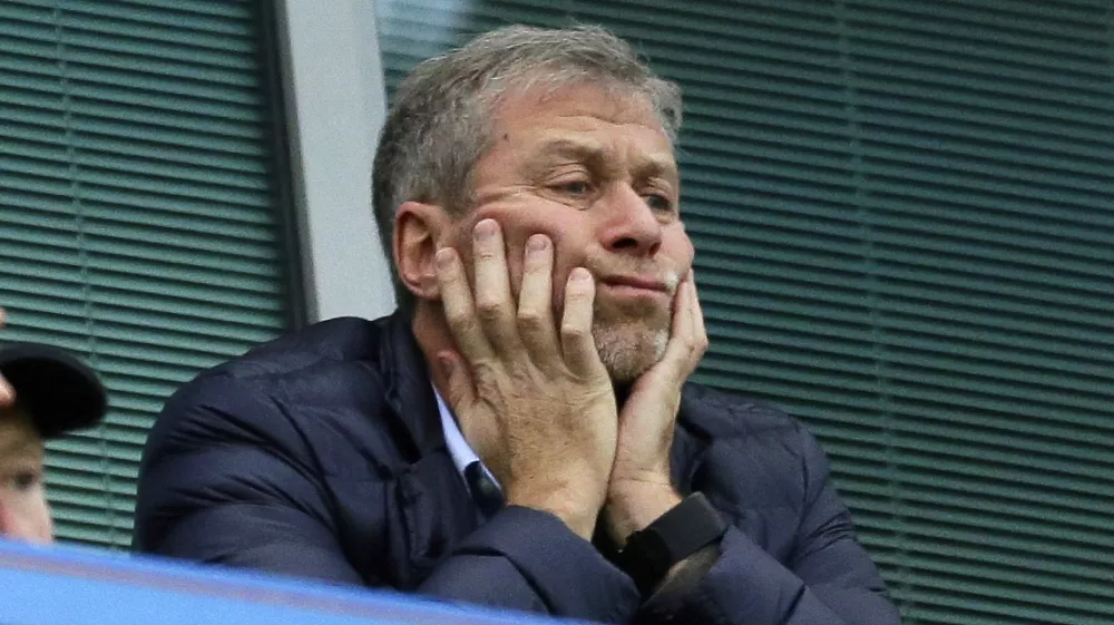 FILE - Chelsea soccer club owner Roman Abramovich sits in his box before their English Premier League soccer match against Sunderland at Stamford Bridge stadium in London, Dec. 19, 2015. Chelsea owner Roman Abramovich has on Saturday, Feb. 26, 2022 suddenly handed over the &acirc;&euro;śstewardship and care&acirc;&euro;ť of the Premier League club to its charitable foundation trustees. The move came after a member of the British parliament called for the Russian billionaire to hand over the club in the wake of Russia&acirc;&euro;&trade;s invasion of Ukraine. (AP Photo/Matt Dunham, File)