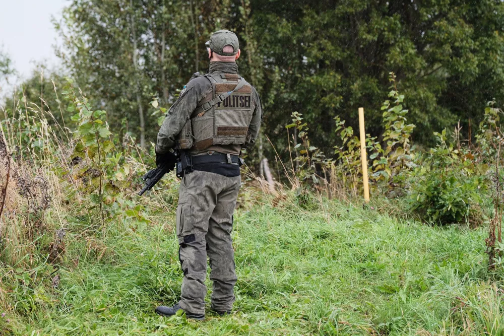 An Estonian border guard patrols the Russian border near Vinski, Estonia, Monday, Sept. 15, 2025. (AP Photo/Hendrik Osula)
