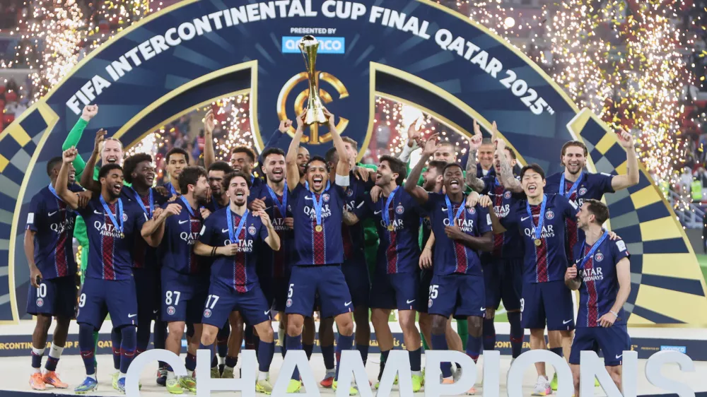 PSG's Marquinhos lifts the trophy after winning the FIFA Intercontinental Cup final soccer match between Flamengo and Paris Saint-Germain in Doha, Qatar, Wednesday, Dec. 17, 2025. (AP Photo/Hussein Sayed)