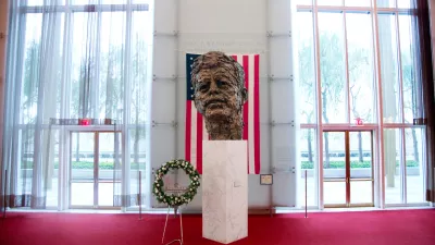 FILE - A memorial wreath stands next to the bronze memorial bust by Robert Berks of President John F. Kennedy in the grand foyer at the John F. Kennedy Center for the Performing Arts in Washington, Nov. 22, 2013, on the 50th anniversary of Kennedy's death. (AP Photo/Carolyn Kaster, File)