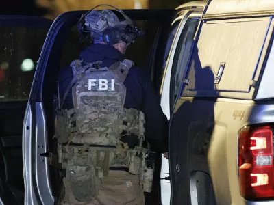 A member of the FBI returns equipment to their vehicle at a storage facility where the Brown University shooter, identified by authorities as Claudio Neves Valente, took his own life, in Salem, New Hampshire, U.S., December 18, 2025. REUTERS/CJ Gunther