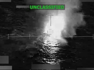 A vessel that the U.S. military said was suspected of smuggling drugs, burns after being struck with a kinetic weapon in a location given as the Eastern Pacific, in this screengrab taken from a handout video released December 18, 2025. U.S. Southern Command/Handout via REUTERS. THIS IMAGE HAS BEEN SUPPLIED BY A THIRD PARTY. TEXT OVERLAY AND BLURRING FROM SOURCE. VERIFICATION LINES: Reuters was not able to independently verify the location or the date when the video was filmed. Upon checking this footage, no old results were found.