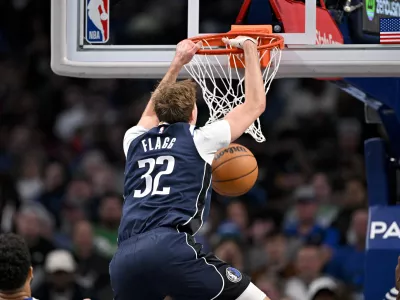 Dec 18, 2025; Dallas, Texas, USA; Dallas Mavericks forward Cooper Flagg (32) dunks the ball against the Detroit Pistons during the second half at the American Airlines Center. Mandatory Credit: Jerome Miron-Imagn Images