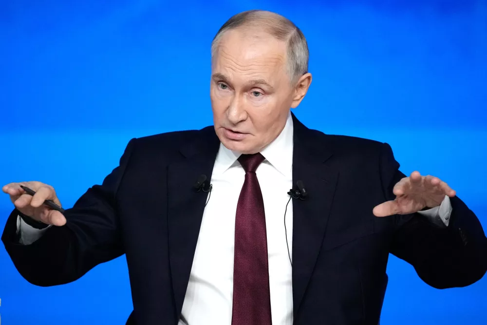 Russian President Vladimir Putin gestures while speaking during his annual news conference and call-in show at Gostinny Dvor, in Moscow, on Friday, Dec. 19, 2025. (AP Photo/Pavel Bednyakov)