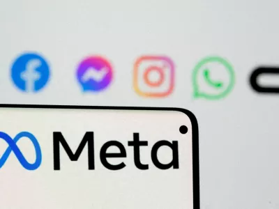 FILE PHOTO: Facebook's new rebrand logo Meta is seen on smartphone in front of displayed logo of Facebook, Messenger, Instagram, Whatsapp and Oculus in this illustration picture taken October 28, 2021. REUTERS/Dado Ruvic/Illustration/File Photo