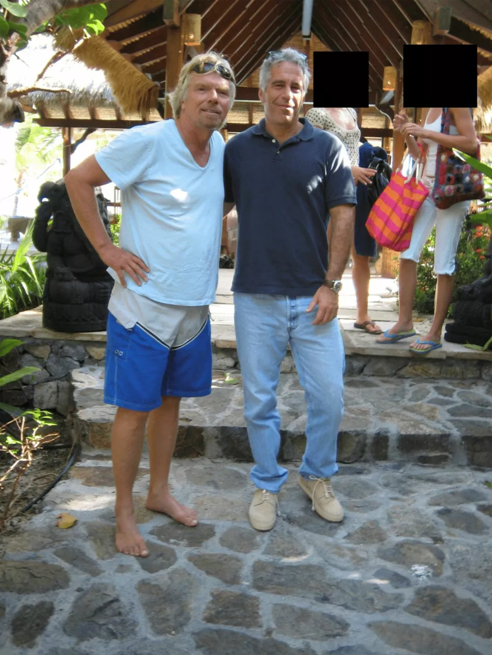 Jeffrey Epstein and Richard Branson are seen in this image released by the Department of Justice in Washington, D.C., U.S., on December 19, 2025 as part of a new trove of documents from its investigations into the late financier and convicted sex offender Jeffrey Epstein. U.S. Justice Department/Handout via REUTERS  THIS IMAGE HAS BEEN SUPPLIED BY A THIRD PARTY REDACTED AREAS FROM SOURCE. THIS PICTURE WAS PROCESSED BY REUTERS TO ENHANCE QUALITY. AN UNPROCESSED VERSION HAS BEEN PROVIDED SEPARATELY.