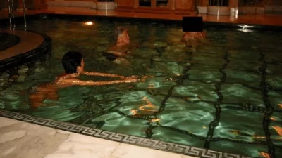 Former U.S. President Bill Clinton swims in a pool in this image released by the Department of Justice in Washington, D.C., U.S., on December 19, 2025 as part of a new trove of documents from its investigations into the late financier and convicted sex offender Jeffrey Epstein. U.S. Justice Department/Handout via REUTERS  THIS IMAGE HAS BEEN SUPPLIED BY A THIRD PARTY REDACTED AREAS FROM SOURCE. THIS PICTURE WAS PROCESSED BY REUTERS TO ENHANCE QUALITY. AN UNPROCESSED VERSION HAS BEEN PROVIDED SEPARATELY.