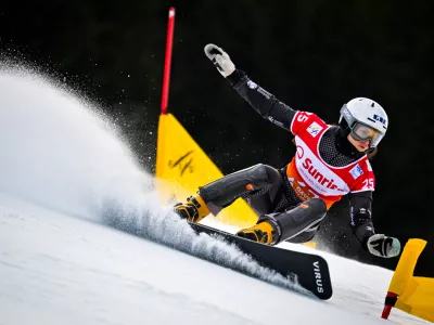 Gloria Kotnik of Slovenia in action during the qualifying round of the FIS Alpine Snowboard Parallel Slalom race, in Davos, Switzerland, Saturday, Dec. 20, 2025. (Gian Ehrenzeller/Keystone via AP)