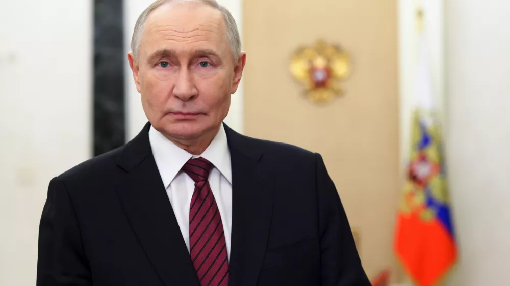 Russian President Vladimir Putin delivers a video address to congratulate officers and veterans on Security Agency Worker's Day at the Kremlin, in Moscow, on Saturday, Dec. 20, 2025. (Mikhail Metzel, Sputnik, Kremlin Pool Photo via AP)