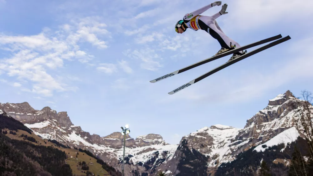 Domen Prevc of Slovenia soars through the air during the men's FIS Ski Jumping World Cup competition at the Gross-Titlis Schanze, in Engelberg, Switzerland, Saturday, Dec. 20, 2025. (Philipp Schmidli/Keystone via AP)