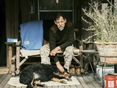 John Koch, a radio reporter in North Florida, at his home with his dog in McAlpin, Fla., on Sunday, Dec. 14, 2025. John Koch, a radio reporter, witnesses every execution in Florida to keep close tabs on what he considers one of the most consequential actions the state takes.,Image: 1060422251, License: Rights-managed, Restrictions:, Model Release: no