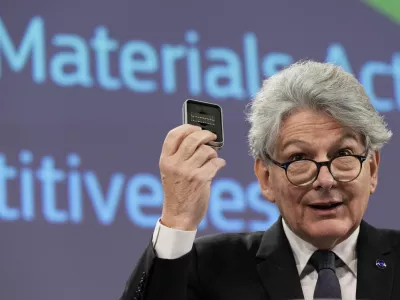 European Commissioner for Internal Market Thierry Breton holds up raw materials during a media conference after the weekly College of Commissioners meeting at EU headquarters in Brussels, Thursday, March 16, 2023. The College on Thursday discussed the Critical Raw Materials Act, the EU's long-term competitiveness strategy, and 30 years of the Single Market. (AP Photo/Virginia Mayo)