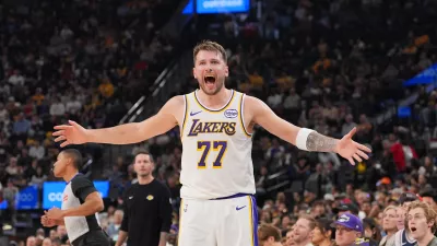 Los Angeles Lakers forward/guard Luka Doncic (77) reacts to a play during the first half of an NBA basketball game against the Los Angeles Clippers Saturday, Dec. 20, 2025, in Inglewood, Calif. (AP Photo/Jae C. Hong)