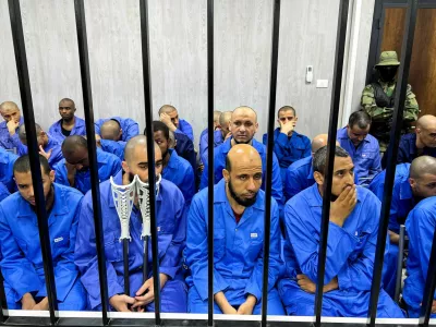 ISIS suspects sit behind bars in the court in Misrata, Libya August 8, 2022. REUTERS/Ayman al-Sahili