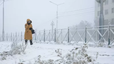 RUSSIA, YAKUTSK - DECEMBER 12, 2025: A woman walk along a snowy street as temperatures plunge to as low as -45C [-43F],Image: 1058697928, License: Rights-managed, Restrictions: * Switzerland And Russia Rights Out *, Model Release: no