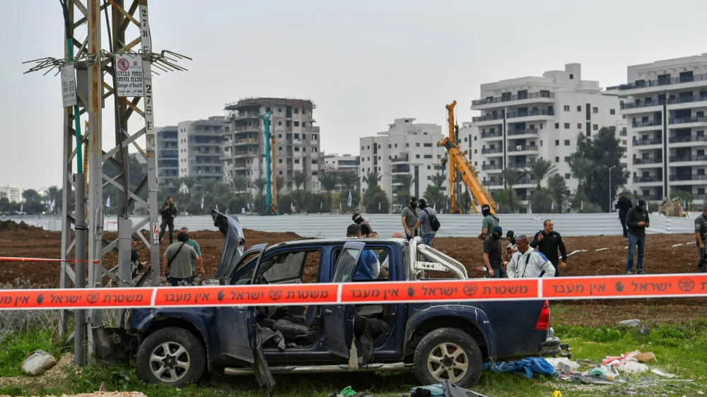 Israeli security forces inspect the scene where a vehicle was used by assailant in a suspected ramming and stabbing attack that killed two people in northern Israel according to Israeli authorities, in Afula, Israel December 26, 2025. REUTERS/Gil Eliyahu ISRAEL OUT. NO COMMERCIAL OR EDITORIAL SALES IN ISRAEL   TPX IMAGES OF THE DAY