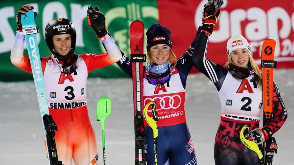 United States' Mikaela Shiffrin, center, winner of an alpine ski, women's World Cup slalom, poses with second placed Switzerland's Camille Rast, left, and third placed Albania's Lara Colturi, in Semmering, Austria, Sunday, Dec. 28, 2025. (AP Photo/Pier Marco Tacca)