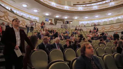 Spectators sit at auditorium of the Mariupol Drama Theatre re-opened its doors for the first time in more than three years, after it was badly damaged during fighting between Russian and Ukrainian forces in Mariupol, Russian-controlled Donetsk region of eastern Ukraine, on Sunday, Dec. 28, 2025. (AP Photo)
