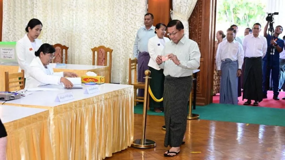 Myanmar's junta chief Min Aung Hlaing walks inside Zayarthiri polling station to vote, on the day of the general elections in Naypyitaw, Myanmar, December 28, 2025. Myanmar Military Information Team/Handout via REUTERS  THIS IMAGE HAS BEEN SUPPLIED BY A THIRD PARTY. NO RESALES. NO ARCHIVES