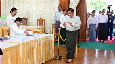 Myanmar's junta chief Min Aung Hlaing walks inside Zayarthiri polling station to vote, on the day of the general elections in Naypyitaw, Myanmar, December 28, 2025. Myanmar Military Information Team/Handout via REUTERS  THIS IMAGE HAS BEEN SUPPLIED BY A THIRD PARTY. NO RESALES. NO ARCHIVES