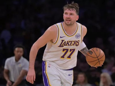 Dec 28, 2025; Los Angeles, California, USA; Los Angeles Lakers guard Luka Doncic (77) handles the ball in the second half against the Sacramento Kings at Crypto.com Arena. Mandatory Credit: Jayne Kamin-Oncea-Imagn Images