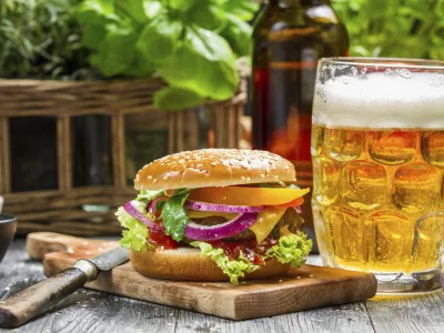 Closeup of fresh burger and a cold beer