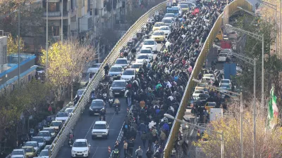 Protesters march in downtown Tehran, Iran, Monday, Dec. 29, 2025. (Fars News Agency via AP)