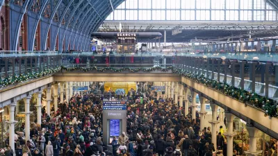 Travellers queue for Eurostar services at St Pancras International station in London, Tuesday, Dec. 30, 2025. (AP Photo/Alberto Pezzali)