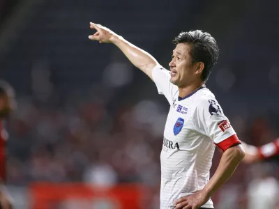 FILE PHOTO: Yokohama FC's Japanese striker Kazuyoshi Miura who is recognised as the world's oldest goalscorer and oldest player currently playing in a professional league, gestures during J. League YBC Levain Cup soccer match against Hokkaido Consadole Sapporo in Sapporo, northern Japan August 12, 2020, in this photo taken by Kyodo. Picture taken August 12, 2020. Mandatory credit Kyodo/via REUTERS ATTENTION EDITORS - THIS IMAGE WAS PROVIDED BY A THIRD PARTY. MANDATORY CREDIT. JAPAN OUT. NO COMMERCIAL OR EDITORIAL SALES IN JAPAN./File Photo