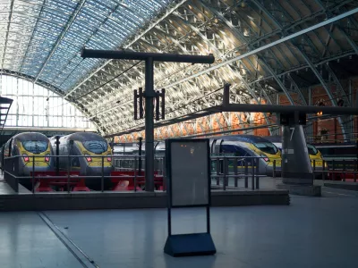 Eurostar trains at platforms as travellers queue for the service at St Pancras International station in London, Tuesday, Dec. 30, 2025. (AP Photo/Alberto Pezzali)